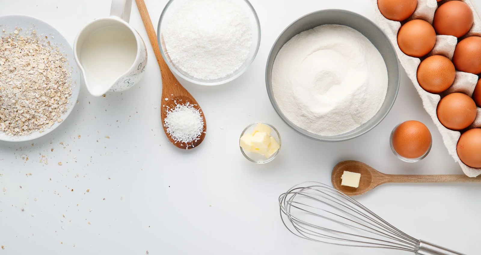 Baking ingredients neatly arranged on a light work surface